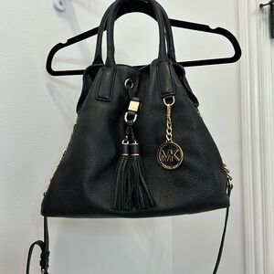 Black Michael kors bag. I love this bag but needing to clean out closets